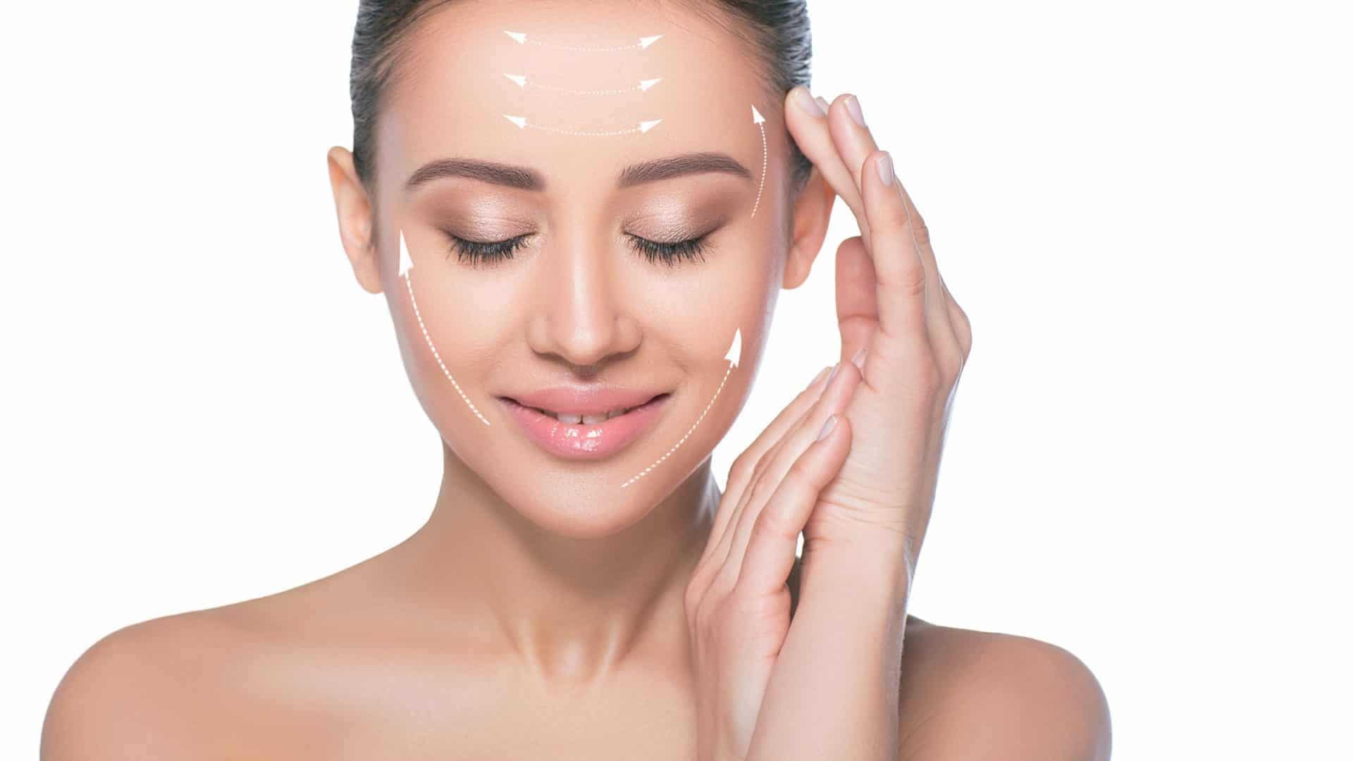 Woman with hands near face lifting fine lines