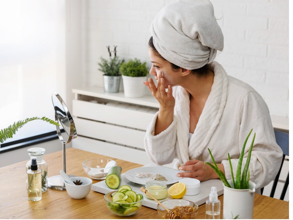 Woman applying mask at home for skincare routine